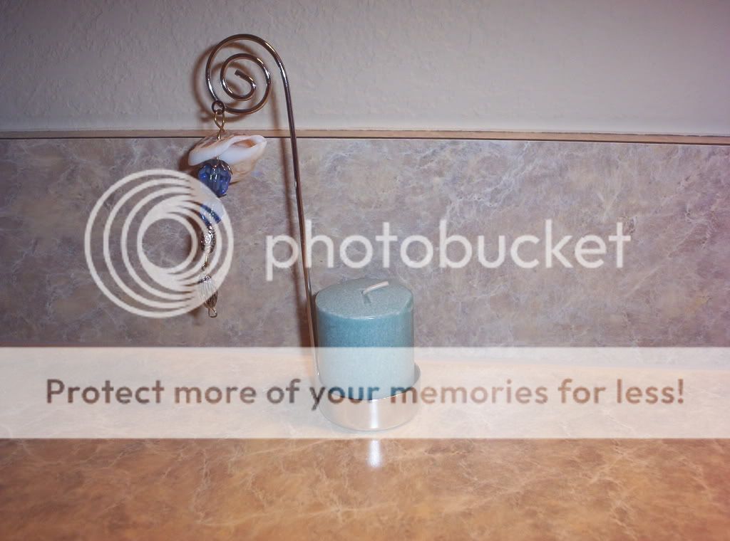 seashellcandleholder.jpg sea shell candle picture by spark56_photo