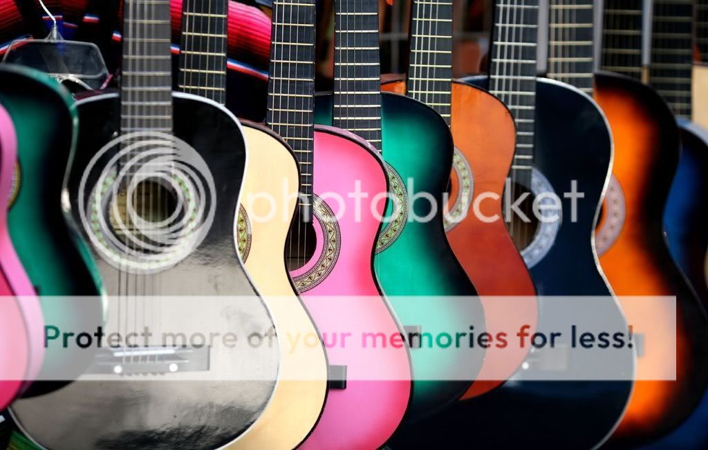 http://i321.photobucket.com/albums/nn386/breakdanse_nothearts/backgrounds/COLORFULGUITARS.jpg